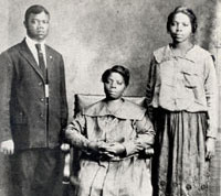 Young Louis Armstrong with his mother and sister. 